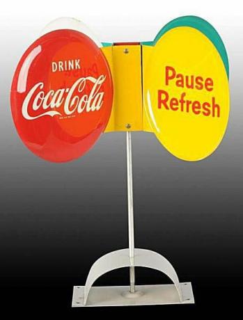 Ca. שנות ה -50 שלט ומבסיס של קוקה קולה מסובב
