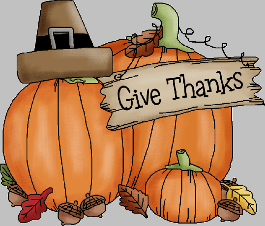 Abóboras e uma placa que diz " Dê graças"