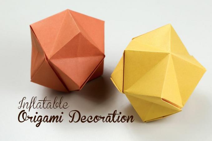 Täispuhutavad origami tähed oranži ja kollasega.