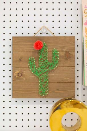 Lógó aranyos kaktusz húros művészet